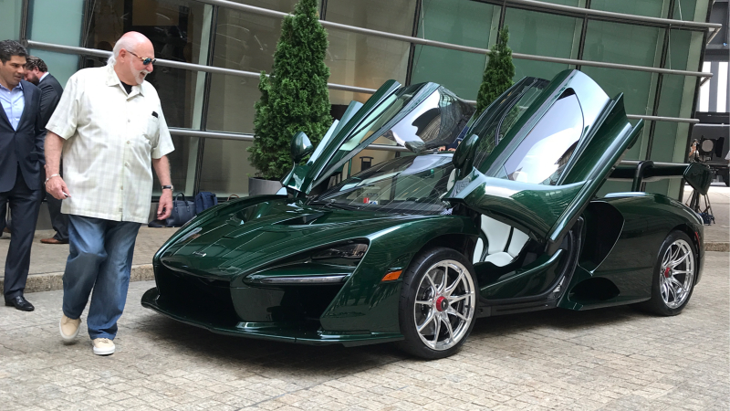 Fux looks very pleased with his new car and its chrome wheels.